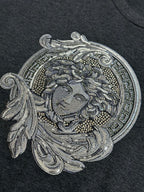 Versace Medusa-inspired front graphic on dark heather gray T-shirt, sequin-style detail