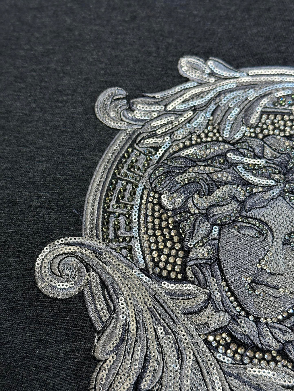Versace Medusa front graphic close-up with bead and sequin-style detailing