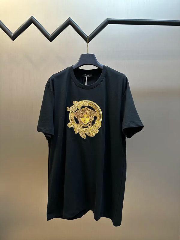 Dark navy T-shirt with gold face graphic centered on chest