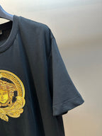 Versace black T-shirt sleeve with gold Medusa crest detail