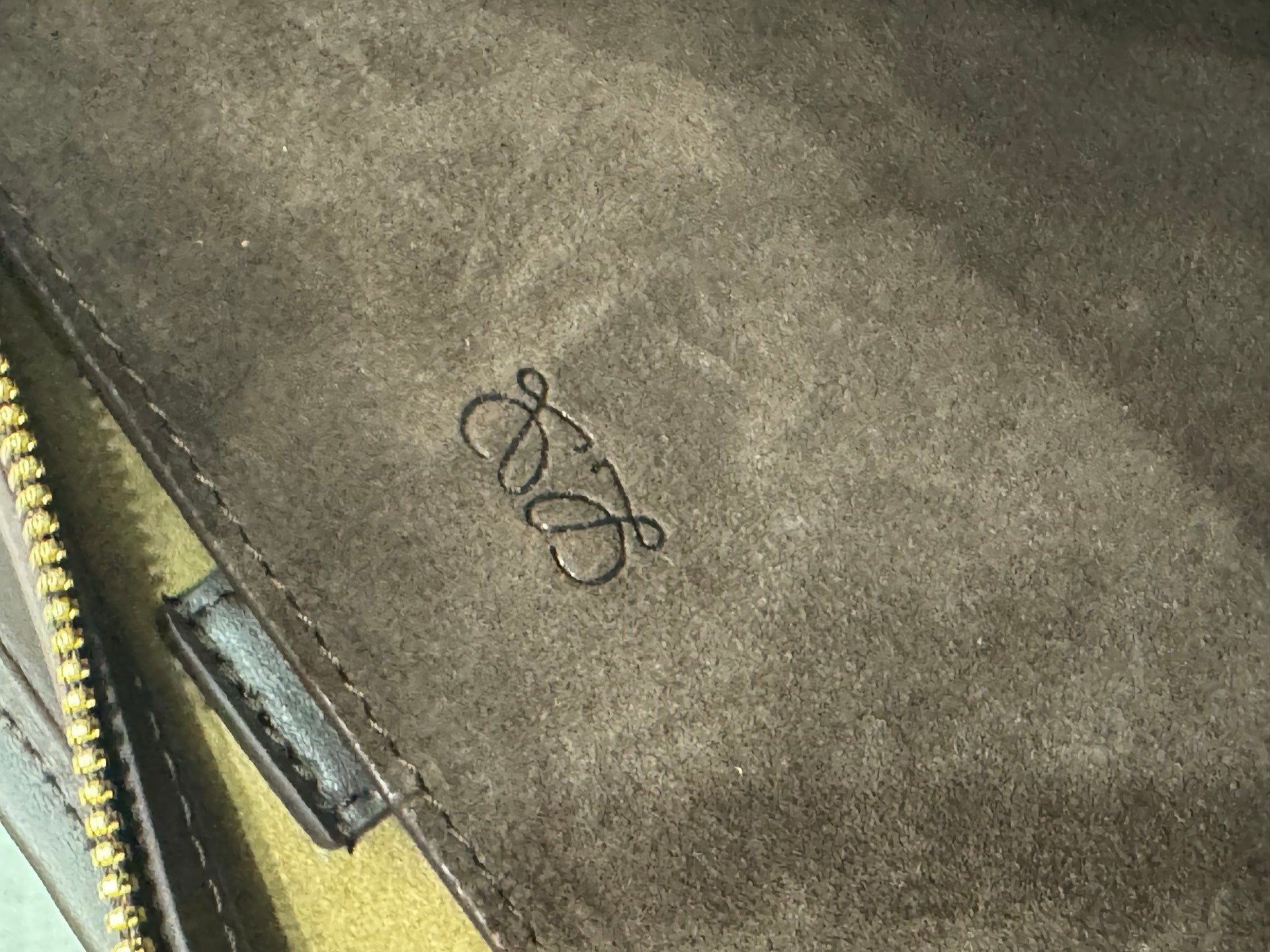 Gold suede interior panel with embroidered Loewe logo