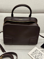 Dark brown leather Loewe top-handle bag with front pockets and gold zipper