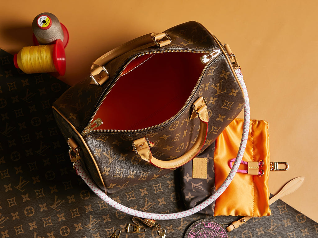 Louis Vuitton monogram crossbody bag with open top and gold zipper trim