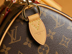 Louis Vuitton monogram bag leather key fob with gold-toned clasp