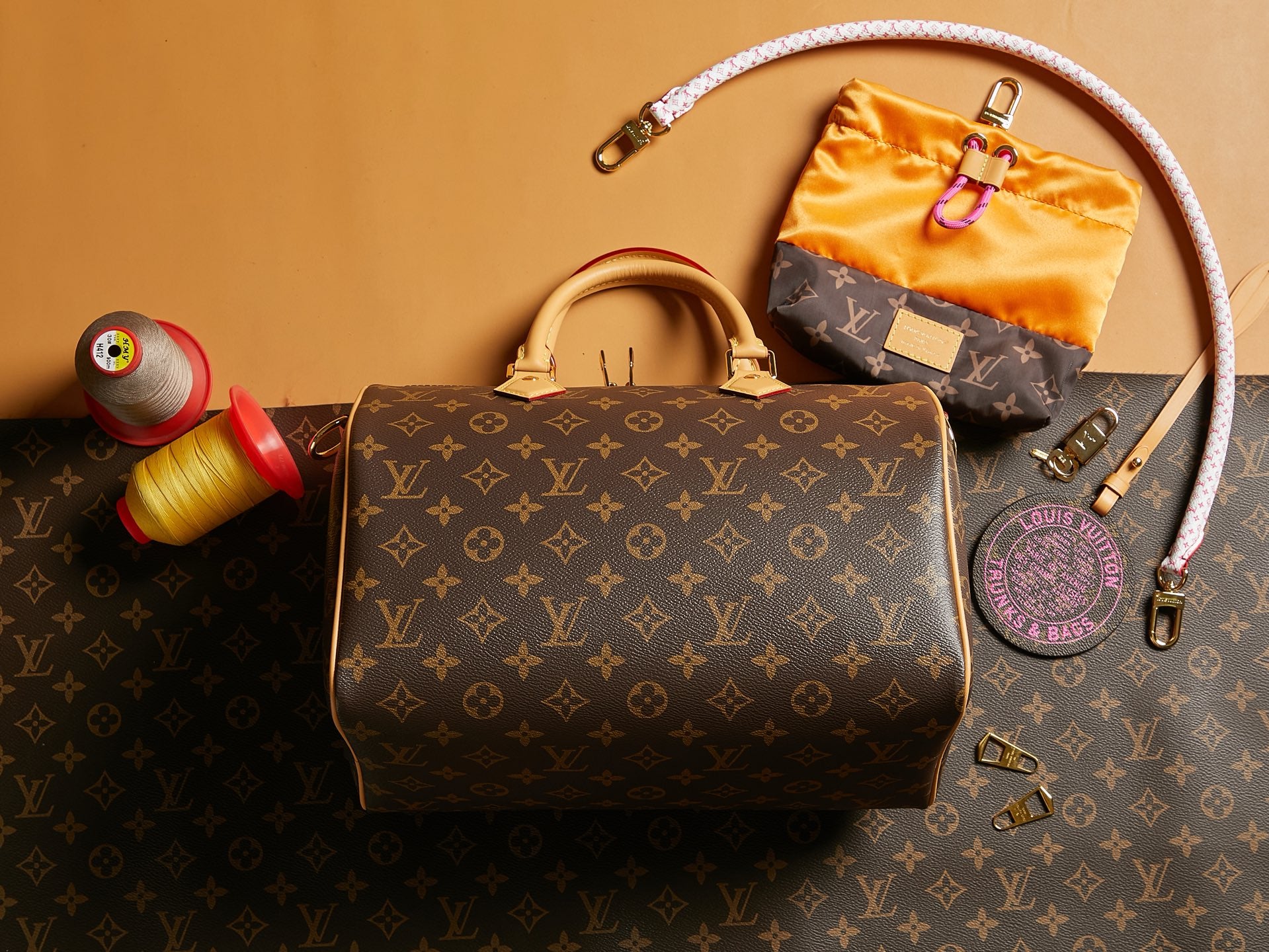 Louis Vuitton monogram handbag with top handles and wristlet strap