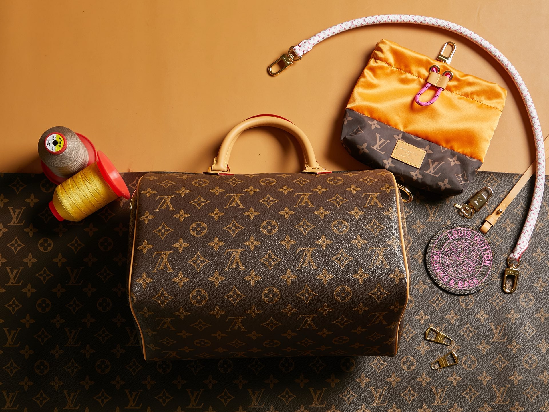 Louis Vuitton monogram handbag with top handles and zipper hardware