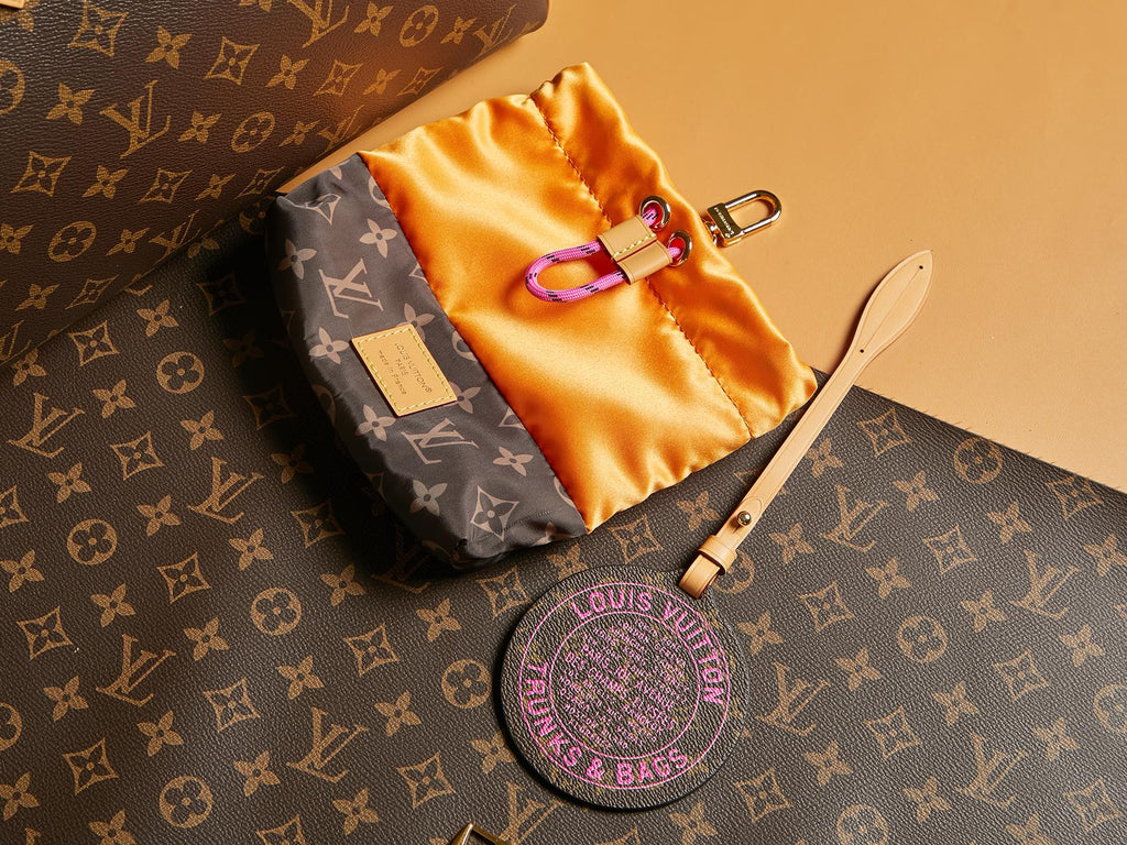 Louis Vuitton monogram bag with satin pouch, round logo key holder, and strap
