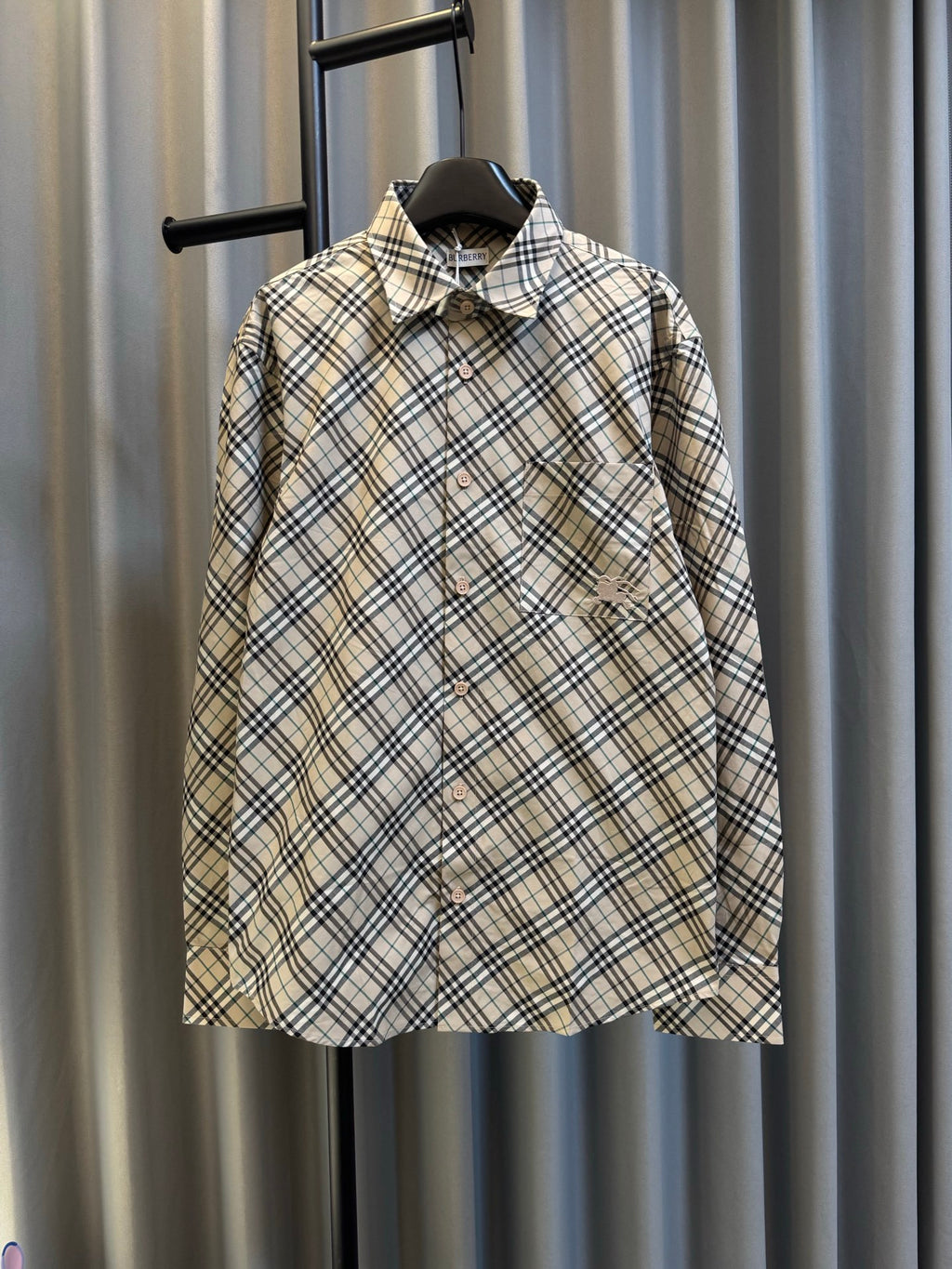 Burberry plaid button-up shirt with pointed collar, long sleeves, chest pocket