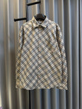 Burberry plaid button-up shirt with pointed collar, long sleeves, chest pocket