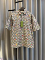 Gucci short-sleeve shirt in light gray with multicolor logo print and button placket