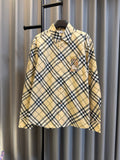 Burberry plaid button-up shirt in tan with navy check pattern and logo chest pocket