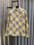 Burberry plaid button-up shirt in tan with navy check pattern and logo chest pocket