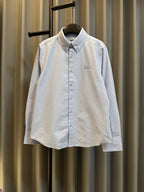 Light blue Burberry button-up shirt with pointed collar and small chest logo
