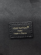 Louis Vuitton Paris label on dark black leather, made in France