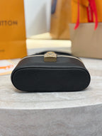 Louis Vuitton bag bottom with round logo plaque on dark black pebble leather