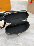 Louis Vuitton bag open interior with dark lining and gold zipper hardware