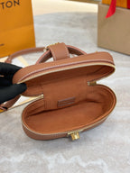 Louis Vuitton brown leather bag interior view with zipper edge and gold-toned hardware