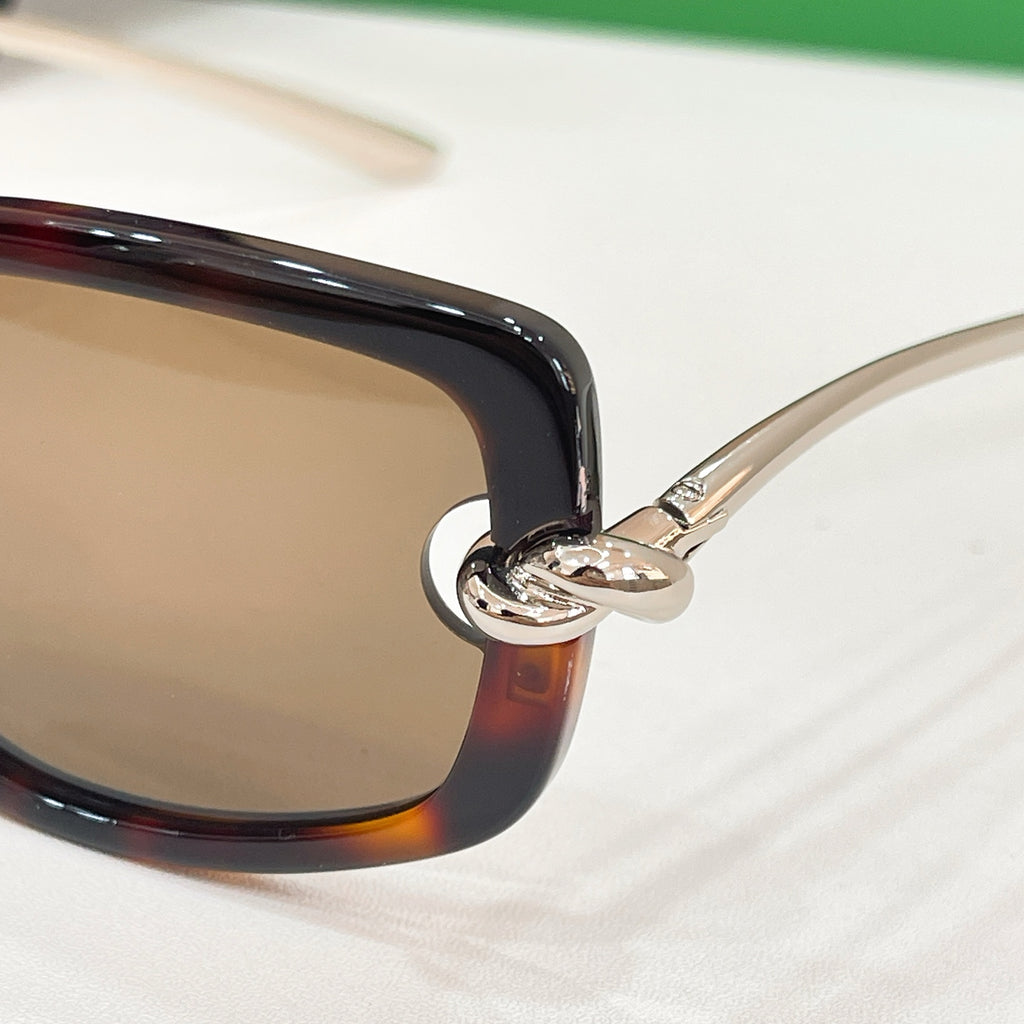 Bottega Veneta sunglasses hinge, glossy black frame with silver hinge hardware