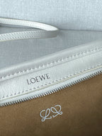 White leather handbag zipper with LOEWE lettering on the interior lining