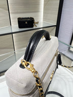 Chanel bag in light gray leather with black strap, gold chain hardware and zipper