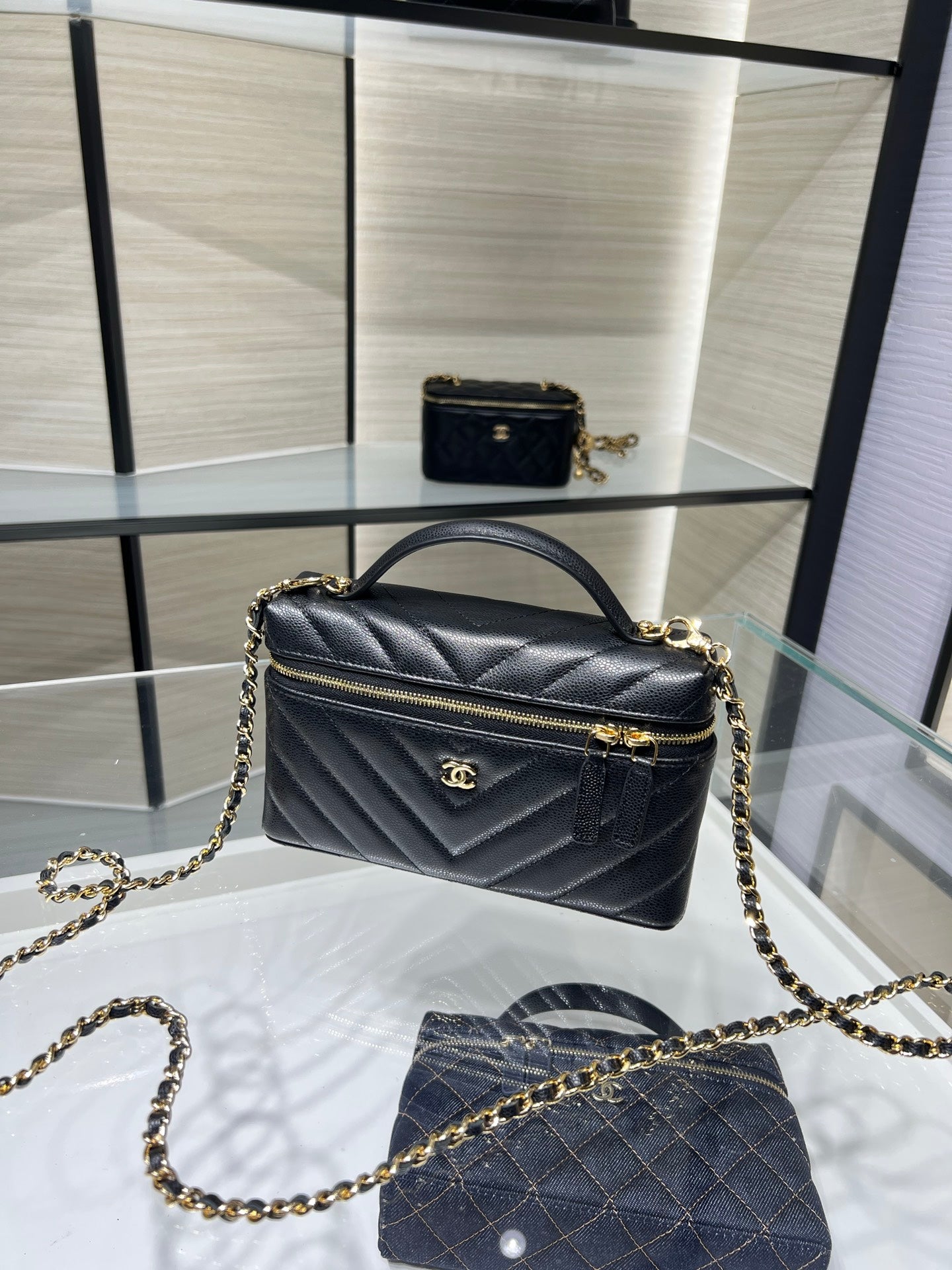 Chanel quilted top-handle mini bag with chain strap, black leather, gold hardware