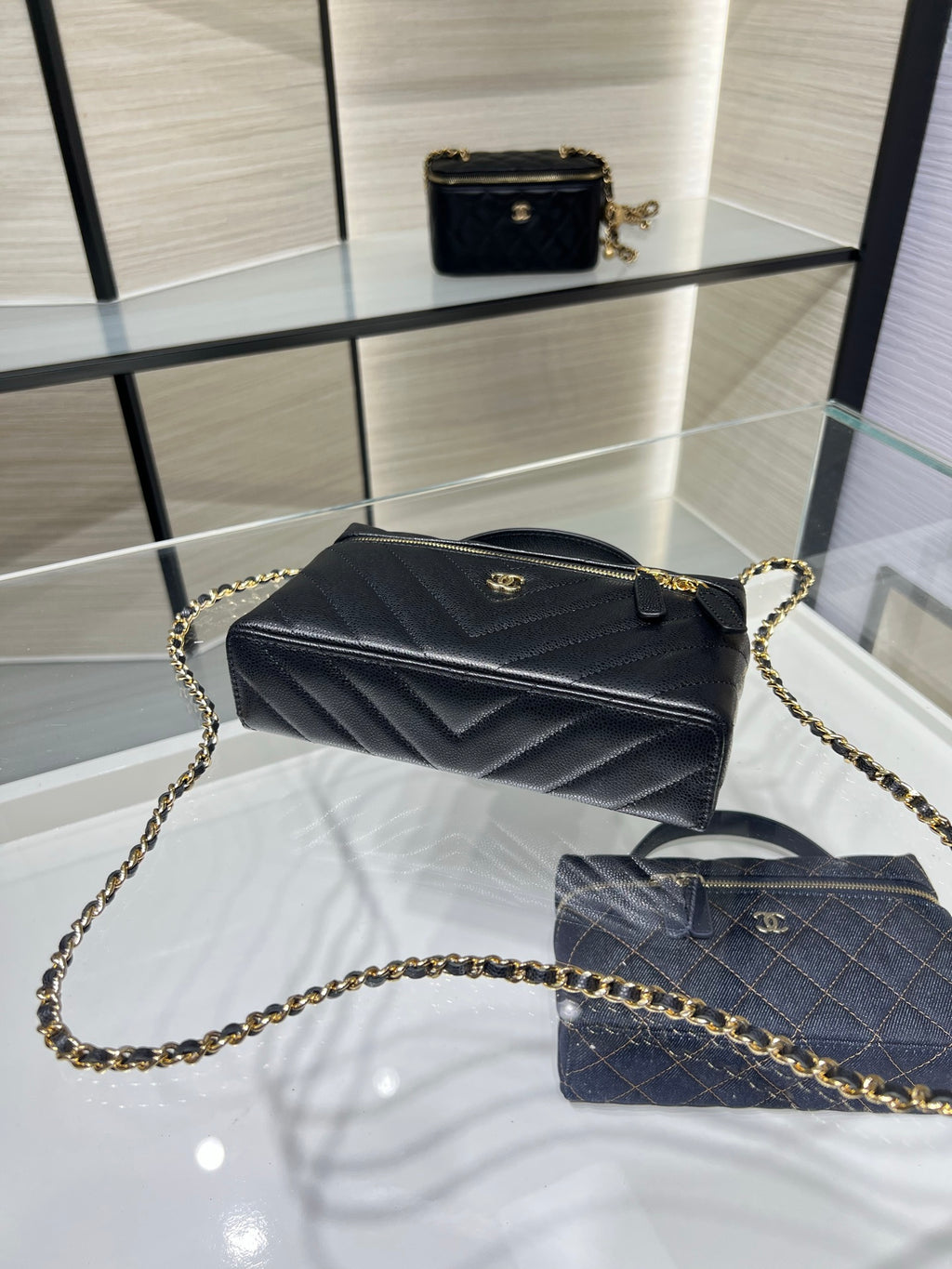 Chanel quilted mini bag with gold chain strap, black leather, top handle