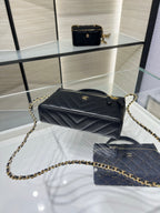 Chanel quilted mini bag with gold chain strap, black leather, top handle