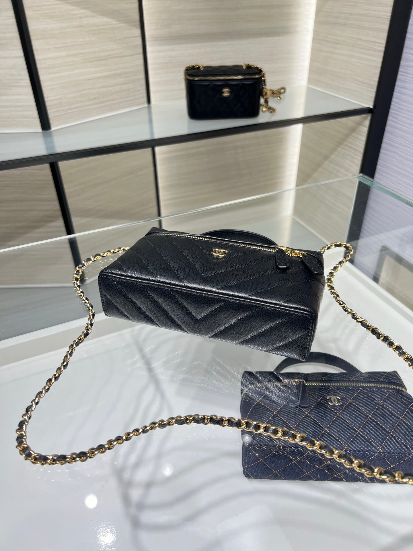 Chanel quilted mini bag with gold chain strap, black leather, top handle