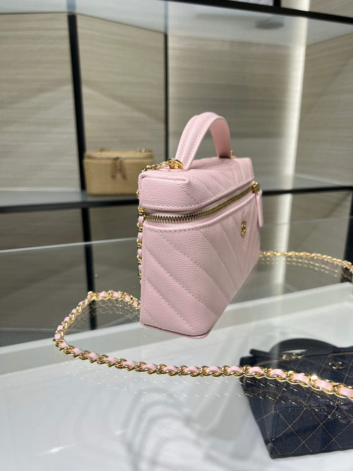 Pink quilted mini bag with gold chain strap and zip top