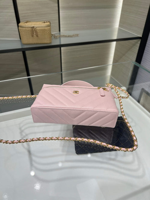 Pink rectangular quilted clutch with gold chain strap and front twist clasp