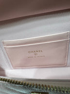 Pink leather bag label reading CHANEL and Made in France