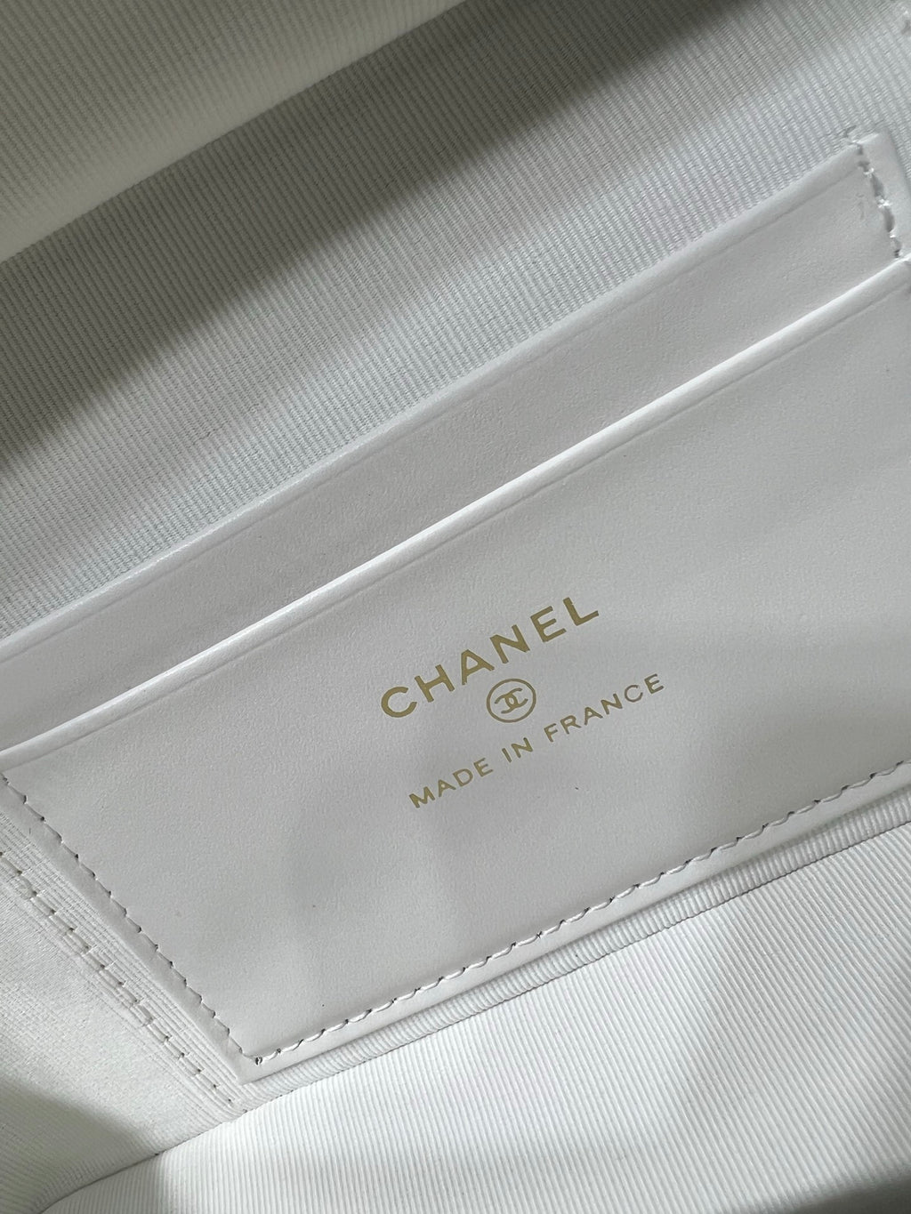 Chanel bag inside label on white lining: CHANEL and MADE IN FRANCE