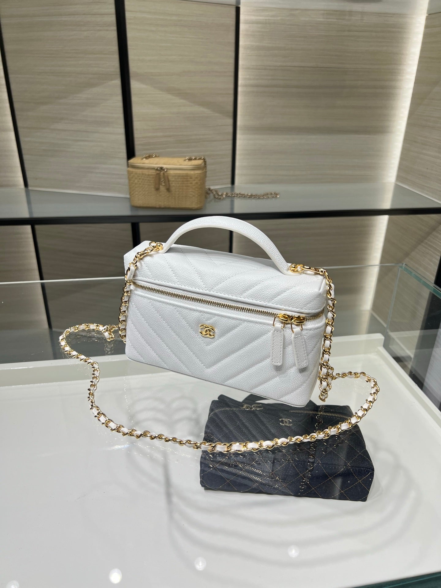 Chanel small white quilted bag with top handle and gold chain strap