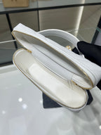 Chanel white quilted bag interior with zip pocket and stitched leather trim