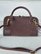 Loewe bag front view with two handles, shoulder strap, and gold buckle details.