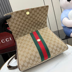 Gucci GG canvas flap clutch with red and green stripe and small gold button detail