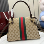 Gucci GG canvas shoulder bag with red and green stripe, front flap, and gold hardware