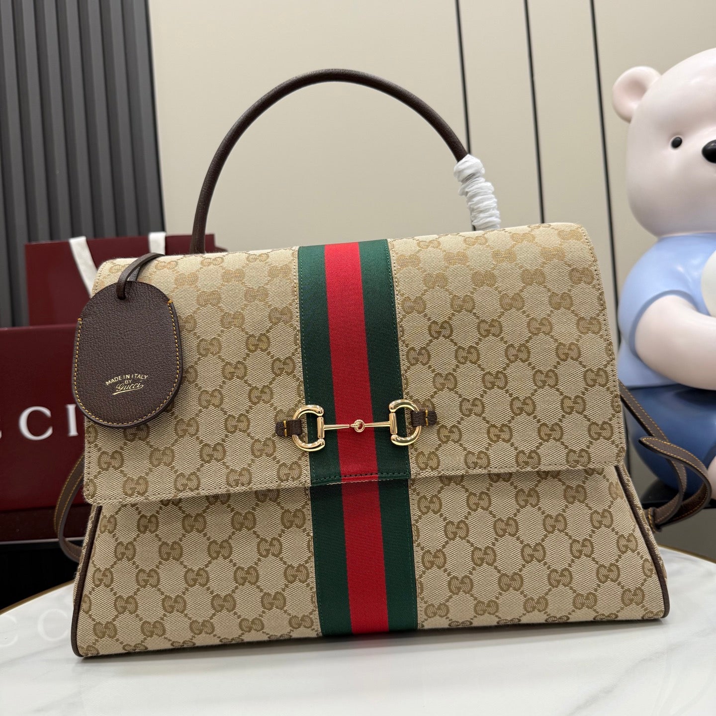 GG-print shoulder bag with green and red stripe and brown leather trim, front view