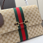 GG-print flap bag close-up with green/red stripe and gold-tone clasp hardware