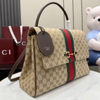 GG-print shoulder bag side view with green/red stripe, top flap, and leather hang tag