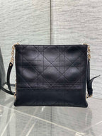 Dior quilted leather shoulder bag with chain strap and flap front, dark navy.