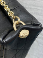 Dior chain shoulder bag end with gold-tone links and small logo plaque.