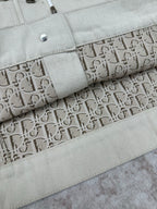 Sleeve cuff with snap and patterned logo lining