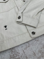 White jacket with CD logo patch on pocket flap and snap button