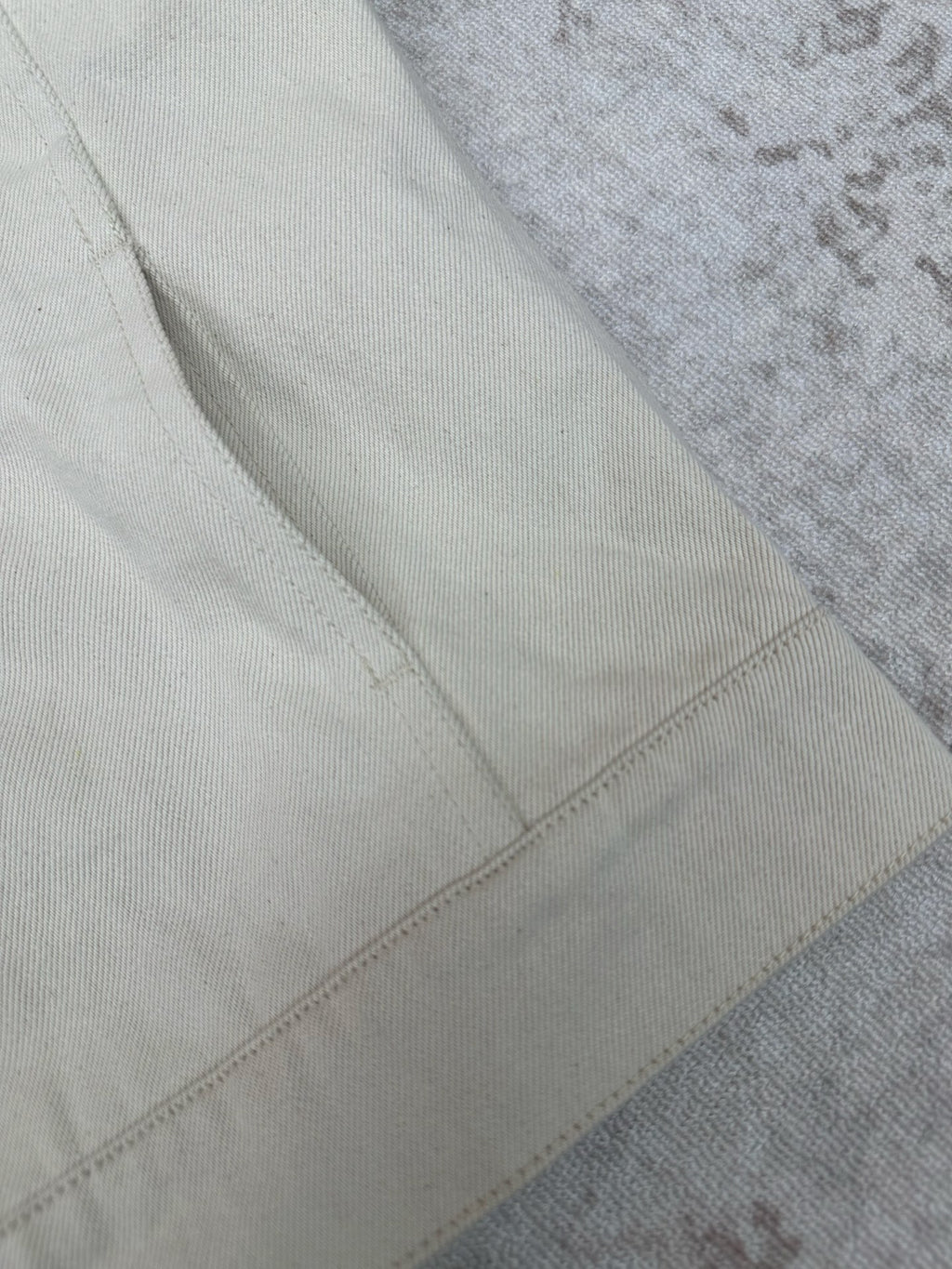 White jacket fabric with stitched seam panel