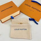 Beige Louis Vuitton logo pouch with blue ribbon tie and gold ring detail