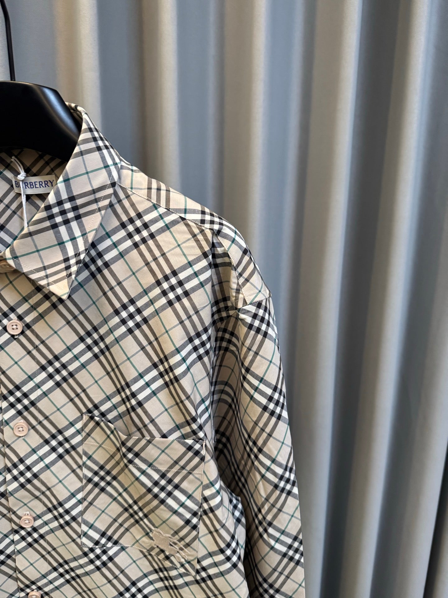 Burberry plaid shirt with side pocket detail and buttoned front