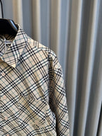 Burberry plaid button-up shirt sleeve with shoulder pleat and cuff area