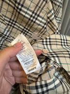 Burberry plaid shirt care label on inner seam
