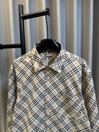 Burberry plaid button-up shirt with pointed collar and chest pocket